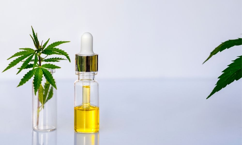a small bottle of cbd oil containing an amber colored solution