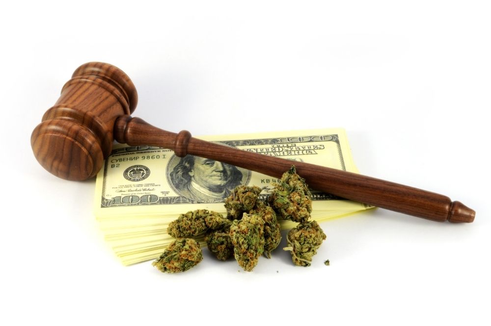 weed-with-money-and-wooden-gavel