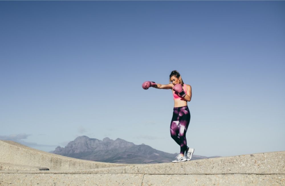 woman boxing in the middle of nowhere