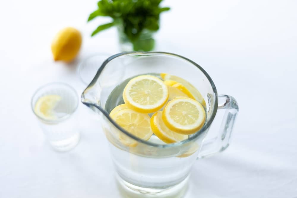 large pitcher of water with lemons